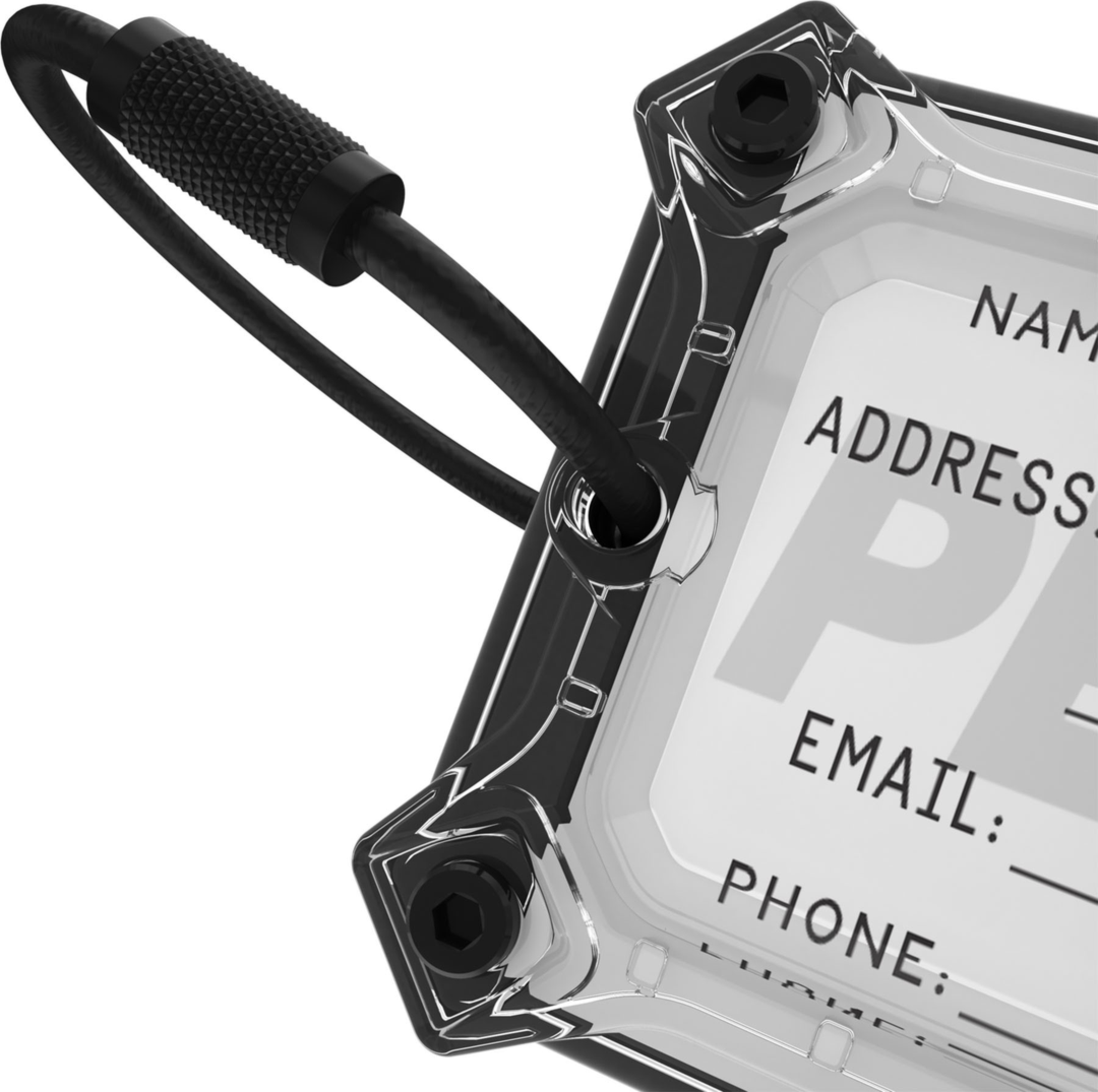 The Pelican Protector Luggage Tag offers rugged, military-grade protection for an AirTag and name card within its screw-secured, steel-reinforced hardshell with detachable stainless steel cable.
