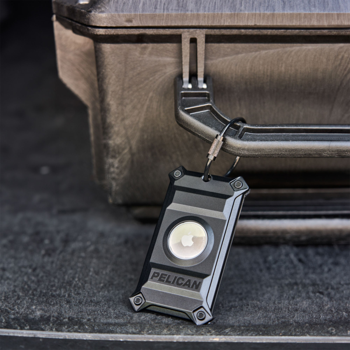 The Pelican Protector Luggage Tag offers rugged, military-grade protection for an AirTag and name card within its screw-secured, steel-reinforced hardshell with detachable stainless steel cable.